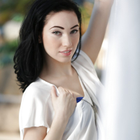 Petite brunette babe Aria Alexander posing fully clothed outdoors