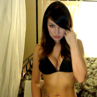 Sexy Korina Bliss posing for her Webcam showing her Tattoo