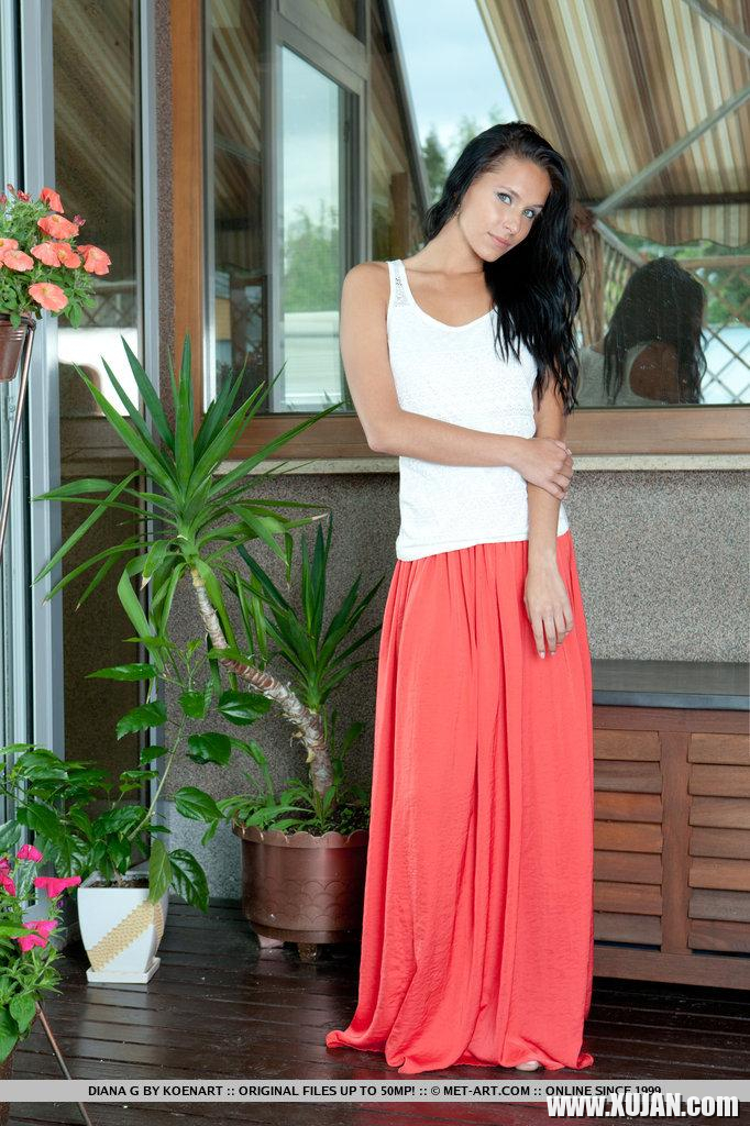 Diana looks fresh and youthful with her long black hair cascading down and her bright blue eyes reflecting the morning light She lifts the hem of her skirt giving us a peek preview of her long svelte legs - Photo #2142969