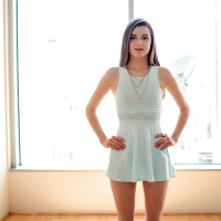 Young girl Alex Mae posing in short white dress before stripping for anal