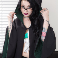 Tattooed goth chick strutting solo in pleated skirt and over the knee socks