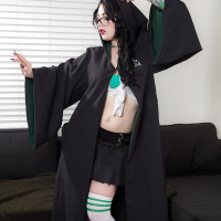 Tattooed goth chick strutting solo in pleated skirt and over the knee socks