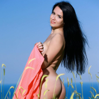 Blackhaired beauty Lola Marron shows off her sexy curves outside