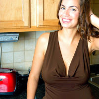 Pictures of Lucinda dressed in brown In the kitchen