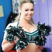 Big titted cheerleader Abbey Brooks gets naked on the floor