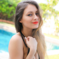 Yarina A slips out of her bathing suit by the pool