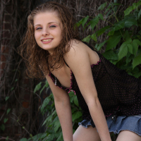 Lil Candy poses in her black teddy nightgown