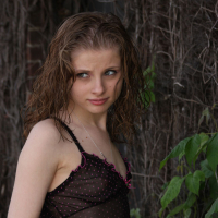 Lil Candy poses in her black teddy nightgown
