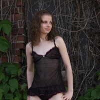 Lil Candy poses in her black teddy nightgown