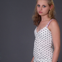 Lil Candy masturbates to a xxx porn magazine