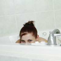 Lil Candy shows off her georgeous teen body while playing in a warm bath of bub