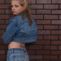 Lil Candy strips out of her denim jacket while showing her cute ass