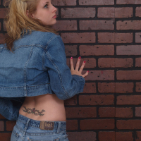 Lil Candy strips out of her denim jacket while showing her cute ass