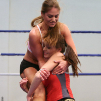 Nelly Sullivan and Chaty Heaven grappling and wrestling