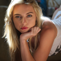 Blonde Chloe relaxes in the warm morning sun