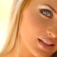 Busty blonde Ines Cudna posing naked outdoors