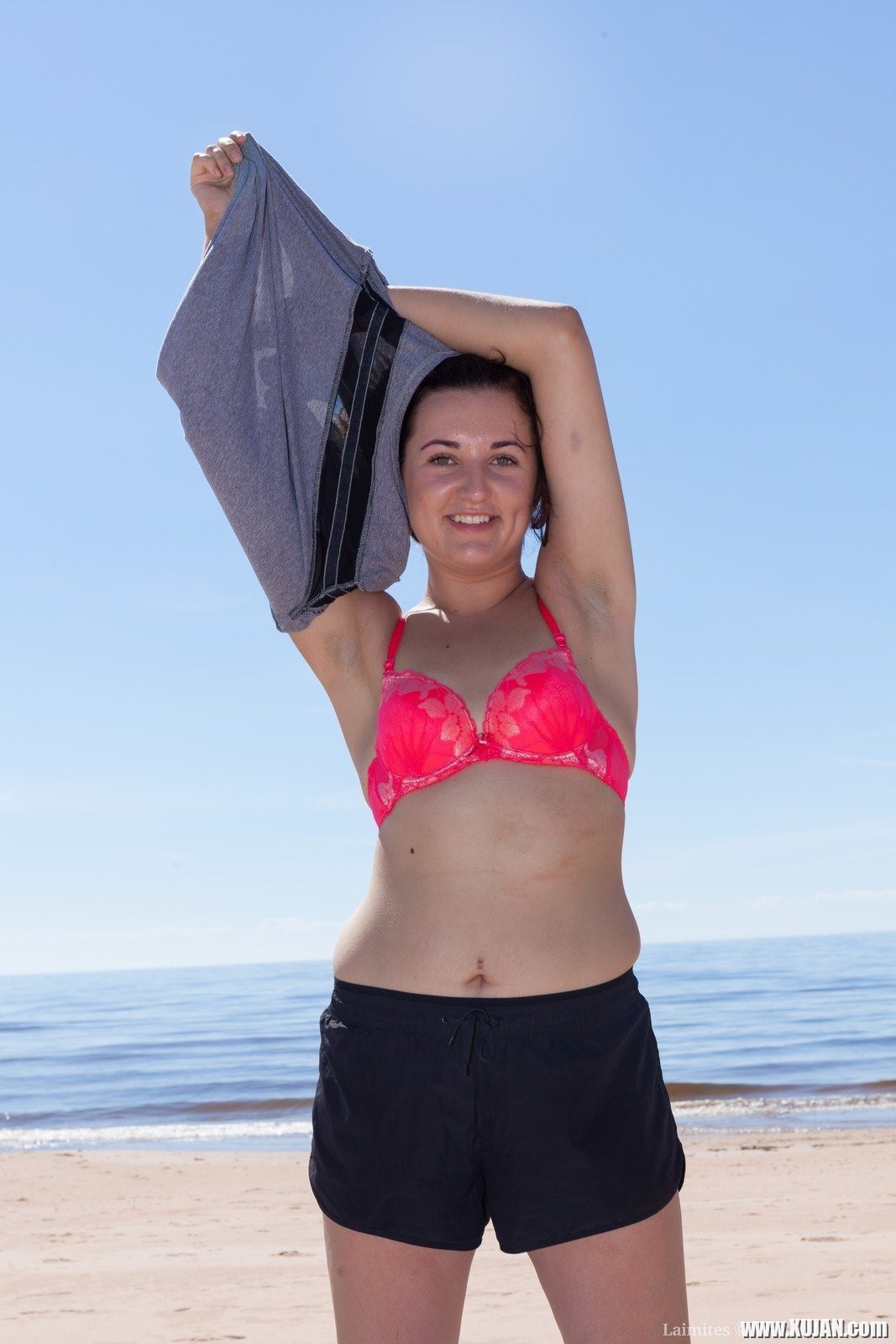Laimites is at the beach exercising and showing off her figure Her grey top and pink lingerie come off and she lays naked on her blue yoga mat She shows us her hairy bush and 32A breasts outdoors - Photo #2274691