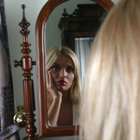 Ines Cudna playing with breasts while doing makeup
