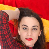 Aragne is having fun in bed in her plaid top and red tights She undresses and rolls around in bed flaunting her hairy body She has very hairy pits an full hairy pussy and hairy legs too