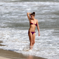 Olivia Palermo pulling down her skimpy bikini top at the beach in St Barts