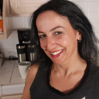 Granny Nina demonstrates her sweet big boobies in the kitchen