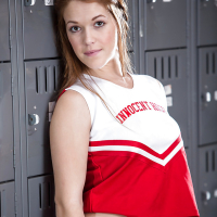 Redhead teen solo girl Kimberly Brix stripping off cheerleader uniform