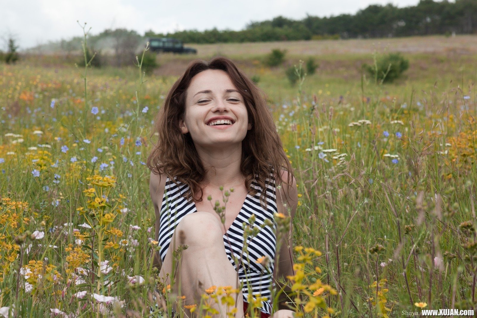 Shaya is enjoying herself in the fields and has a sexy grey dress on She takes off her dress and panties off and relaxes on her red towel She masturbates and fingers her hairy pussy and has fun - Photo #2331492