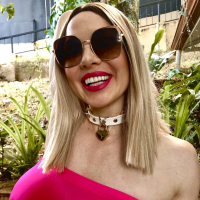 Busty Kylee Nash loves showing off her amazing tits in her warm garden