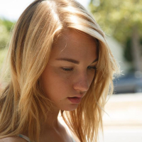 Blonde teen Lily Ivy flashes you by the pool