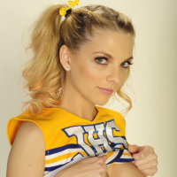 Busty cheerleader Jana Jordan gets naked to show her hairy cunt