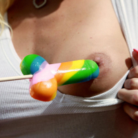 Blonde Cody Love plays with a lollypop
