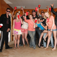 Slutty girls having fun at the drunk party with lascivious guys