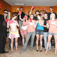 Slutty girls having fun at the drunk party with lascivious guys