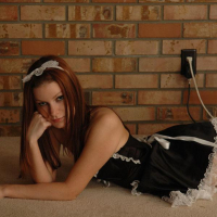 Redhead teen Kori Kitten gets naughty in her maid uniform