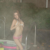 Redhead teen Kori goes out for a late night dip