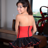 Cute little vixen Josie Ann strips out of her red and black corset