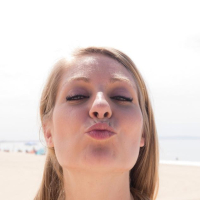 Sexy coed Veronica Weston teases outside on a beach