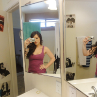 Glamorous young babe Jennifer White makes some self shots in a bathroom