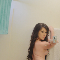 Glamorous young babe Jennifer White makes some self shots in a bathroom