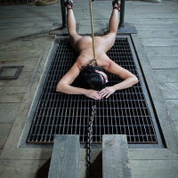 London River is bound for kinky toy sex in dark bdsm dungeon