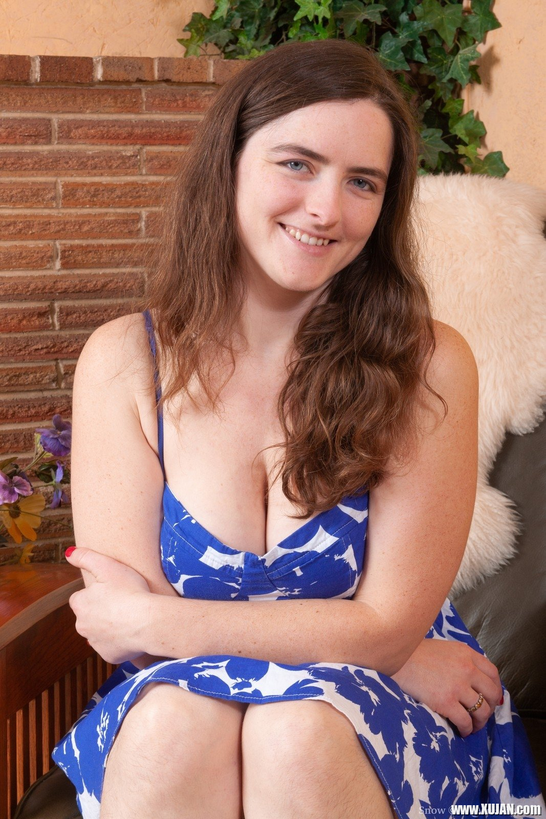 In her armchair Snow is posing in her blue dress and white panties She strokes her hairy pits and then her hairy pussy She finds a special spot spreads her legs touches her body and has fun - Photo #2442109