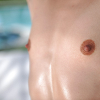 Young chick Elizabeth Bentley shows off her tiny teen tits beside pool