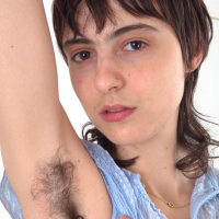 Frida is relaxing on her sofa and showing off her hairy pits She undresses and lays naked on her lonely sofa She has a full hairy pussy that she enjoys touching and shows off her hairy body there
