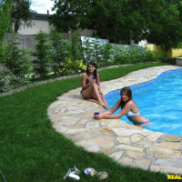 Arousing european babes showing their butts in bikinis at the pool