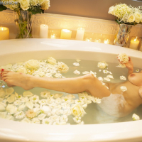 Busty Roberta Gemma lounges sensually in Bathtub