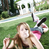 Young babe Ally Ann loses her clothes and flaunts her teenage butt