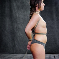 Mia Gold pigtails babe rope bound and mouth gagged with red ball