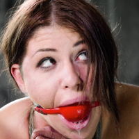 Mia Gold pigtails babe rope bound and mouth gagged with red ball