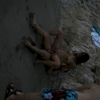 Brunette babe Dolce Elektra fucking a guy while getting filmed on the beach