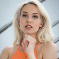 Beautiful blonde Barbie Brill spreads legs to insert a pink dildo